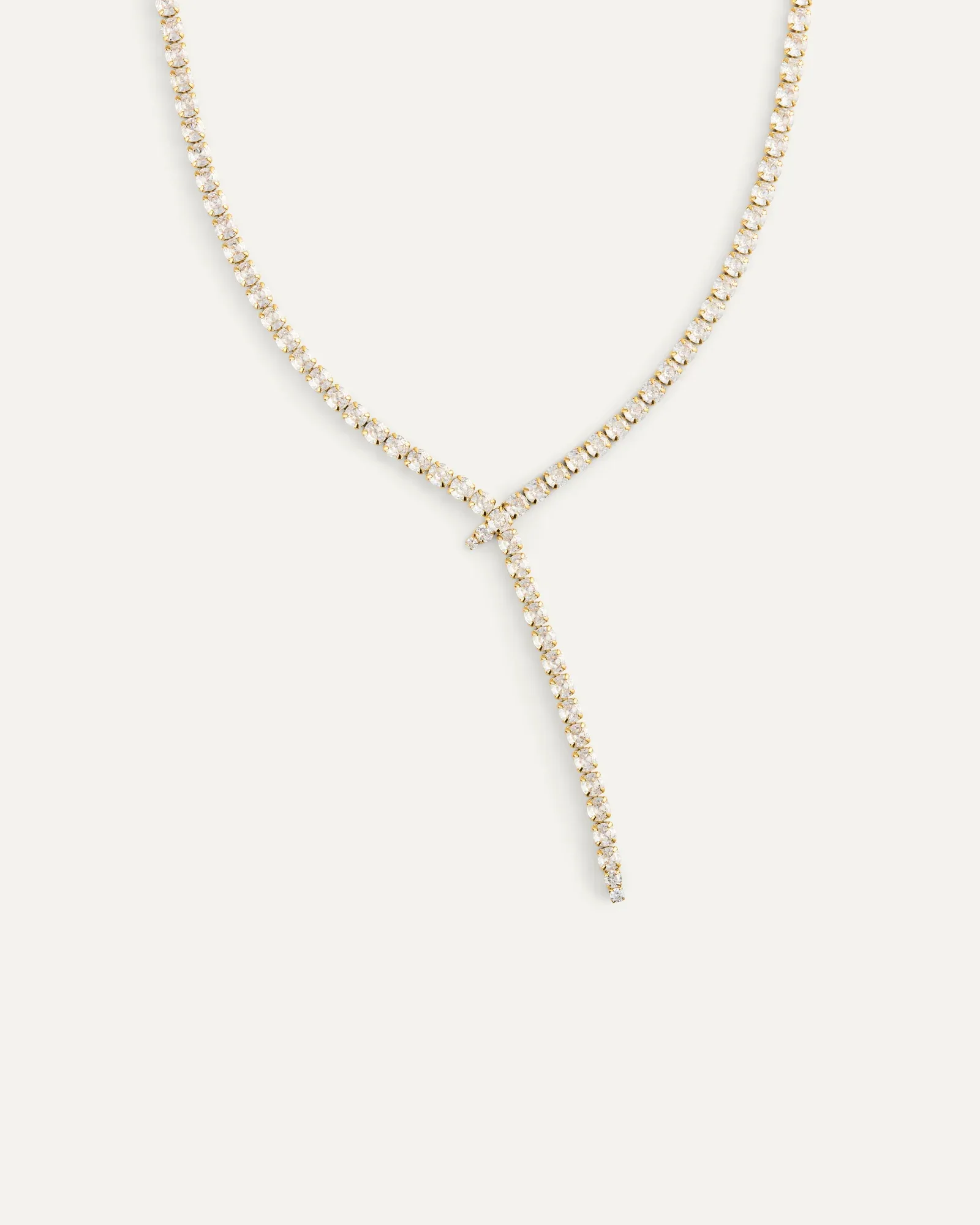 Gold plated steel lariat necklace set with cubic zirconia